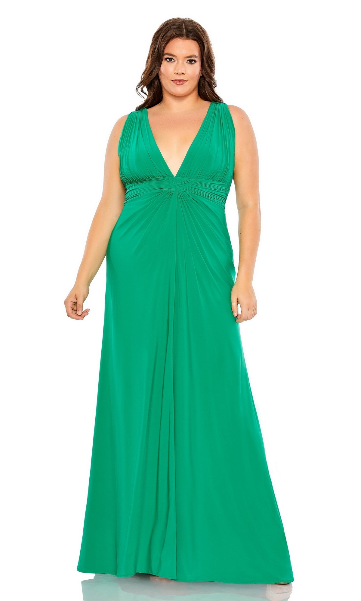 A woman poses gracefully against a white background in the Long Plus-Size Formal Dress 68128 by Mac Duggal, featuring jade green fabric, an empire waist, and a deep V-neckline.